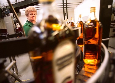 A worker inside the bottling section at Bushmills Distillery. Photo credit: Paul Marshall