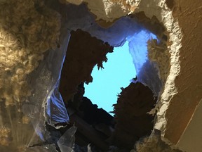 A block of ice crashed into a Mississauga, Ont., family's home and caused this hole in the roof on Jan. 9.