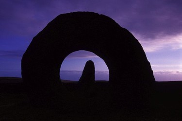 Wait for the magical moment, dusk at the Men-An-Tol sacred stone, Cornwall, England.