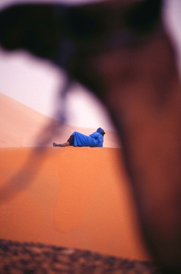 Framing a subject, camel and Bedouin man, Great Erg Chebbi, Morocco.