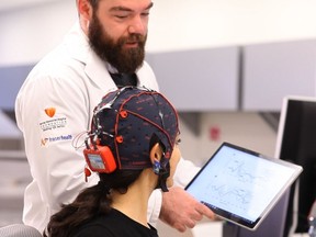 Brain research study lead author and Simon Fraser University Ph.D student Shaun Fickling uses ‘brain vital signs’ to monitor brain function.