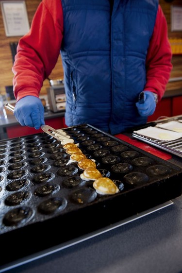 Making Poffertjes (sugary mini pancakes) - Albert Cuyp Markt.