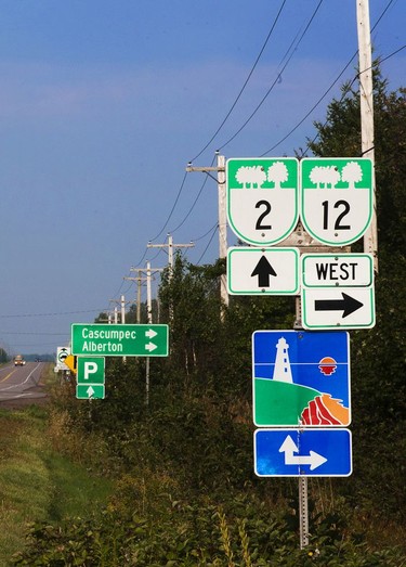 Colourful signage indicates the 350 km 'North Cape Coastal Drive' in the west region of P.E.I.