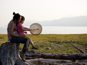 A woman and her daughter from the Haisla First Nation spend time along the Douglas Channel in Kitamaat Village. The Haisla are one of the 25 Indigenous groups that signed agreements with LNG Canada and Coastal GasLink.