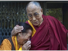 The Dalai Lama, here comforting a devotee in India, is one of many who routinely emphasize kindness and compassion.