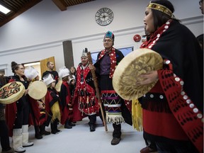 Drummers play as Wet'suwet'en Hereditary Chief Namoks (John Ridsdale), back right, and Chief Madeek (Jeff Brown), back left, hereditary leader of the Gidimt'en clan, enter the room as Indigenous nations and supporters gather to show support for the Wet'suwet'en Nation before marching together in solidarity, in Smithers, B.C., on Wednesday January 16, 2019.
