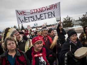 Hereditary Chief Ronnie West, centre, from the Lake Babine First Nation, sings and beats a drum during a solidarity march after Indigenous nations and supporters gathered for a meeting to show support for the Wet'suwet'en Nation, in Smithers, B.C., on Wednesday January 16, 2019.