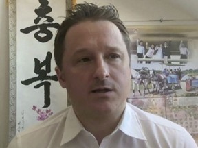 In this image made from video taken on March 2, 2017, Michael Spavor, director of Paektu Cultural Exchange, talks during a Skype interview in Yangi, China. A friend of Michael Spavor says he is worried about the detained Canadian's well-being and financial future now that an online fund-raising effort in his name has been derailed. Andray Abrahamian was among the organizers of a GoFundMe campaign for Spavor, a Canadian arrested last month in China for allegedly endangering Chinese national security. THE CANADIAN PRESS/AP Photo