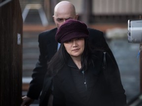 Huawei chief financial officer Meng Wanzhou leaves her home to attend a court appearance regarding her bail conditions, in Vancouver, on Tuesday January 29, 2019.