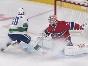 Vancouver Canucks' Elias Pettersson moves in on Montreal Canadiens goaltender Carey Price during first period NHL hockey action in Montreal, Thursday, Jan. 3, 2019. Pettersson has a fan in Maple Leafs head coach Mike Babcock.