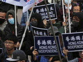 Pro-independence demonstrators march during an annual New Year protest in Hong Kong on Jan. 1, 2019.
