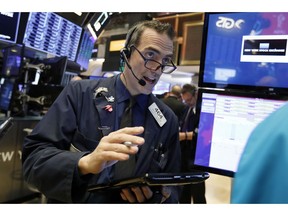 Trader Gregory Rowe works on the floor of the New York Stock Exchange, Wednesday, Jan. 9, 2019. Stocks are opening higher on Wall Street, putting the market on track for a fourth gain in a row.