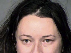 FILE - This undated file booking photo provided by the Maricopa County Sheriff's Office in Arizona shows Jacqueline Claire Ades. Ades, accused of stalking a man she met on a dating site and sending him more than 65,000 text messages, apparently sent more than twice that many. Ades has pleaded not guilty to charges of stalking and criminal trespassing. Her trial is scheduled to begin in February 2019. (Maricopa County Sheriff's Office via AP, File)