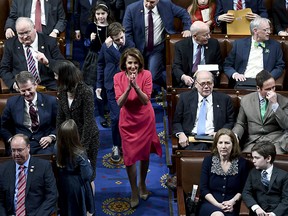 Incoming Speaker of the House Nancy Pelosi(C) arrives at the 116th Congress and swearing-in ceremony on the floor of the US House of Representatives on January 3, 2018 in Washington,DC.