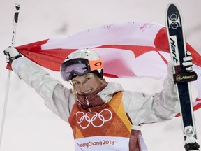 File: Justine Dufour-Lapointe, of Montreal, celebrates after competing to her silver medal finish in the freestyle skiing event at the 2018 Winter Olympic Games, in Pyeongchang, South Korea, on Sunday, February 11, 2018.