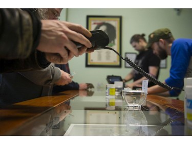 Vancouver, BC's first licensed pot shop, Evergreen Cannabis Society on W. 4th Avenue, officially opens its doors to paying customer Saturday, January 5, 2019. Pictured are the first customers buying cannabis products.