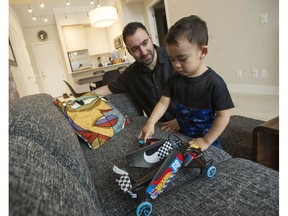 Matt Astifan and his son Marcus in their New Westminster condo on Tuesday, Jan. 22, 2019.