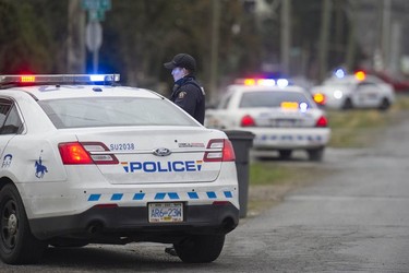 RCMP search the Bridgeview neighbourhood in Surrey on Jan. 31, 2019. They are looking for the person who shot and wounded a Transit Police officer Wednesday afternoon at the Scott Road Skytrain station.