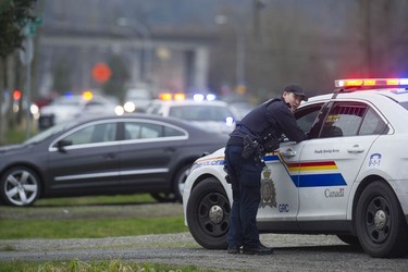 RCMP search the Bridgeview neighbourhood in Surrey on Jan. 31, 2019. They are looking for the person who shot and wounded a Transit Police officer Wednesday afternoon at the Scott Road Skytrain station.