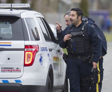 RCMP search the Bridgeview neighbourhood in Surrey on Jan. 31, 2019. They are looking for the person who shot and wounded a Transit Police officer Wednesday afternoon at the Scott Road Skytrain station.