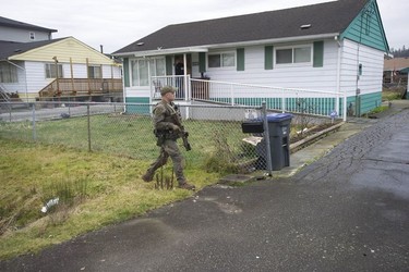 RCMP search the Bridgeview neighbourhood in Surrey on Jan. 31, 2019. They are looking for the person who shot and wounded a Transit Police officer Wednesday afternoon at the Scott Road Skytrain station.