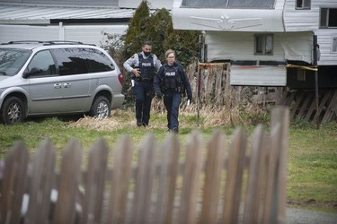 RCMP search the Bridgeview neighbourhood in Surrey on Jan. 31, 2019. They are looking for the person who shot and wounded a Transit Police officer Wednesday afternoon at the Scott Road Skytrain station.