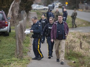 RCMP searching an area of the Bridgeview neighbourhood in Surrey, B.C. Thursday morning, January 31, 2019, following the shooting of a Transit Police officer at Scott Road SkyTrain station on Jan. 30.
