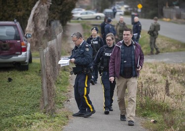 RCMP search the Bridgeview neighbourhood in Surrey on Jan. 31, 2019. They are looking for the person who shot and wounded a Transit Police officer Wednesday afternoon at the Scott Road Skytrain station.