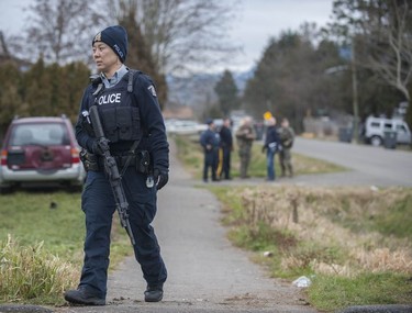 RCMP search the Bridgeview neighbourhood in Surrey on Jan. 31, 2019. They are looking for the person who shot and wounded a Transit Police officer Wednesday afternoon at the Scott Road Skytrain station.