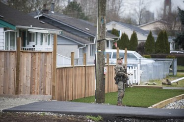 RCMP search the Bridgeview neighbourhood in Surrey on Jan. 31, 2019. They are looking for the person who shot and wounded a Transit Police officer Wednesday afternoon at the Scott Road Skytrain station.