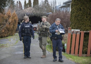 RCMP search the Bridgeview neighbourhood in Surrey on Jan. 31, 2019. They are looking for the person who shot and wounded a Transit Police officer Wednesday afternoon at the Scott Road Skytrain station.