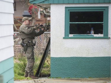 RCMP search the Bridgeview neighbourhood in Surrey on Jan. 31, 2019. They are looking for the person who shot and wounded a Transit Police officer Wednesday afternoon at the Scott Road Skytrain station.