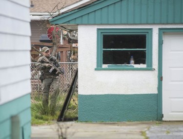 RCMP search the Bridgeview neighbourhood in Surrey on Jan. 31, 2019. They are looking for the person who shot and wounded a Transit Police officer Wednesday afternoon at the Scott Road Skytrain station.