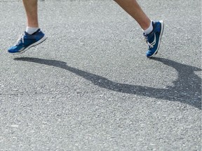 VANCOUVER,BC:APRIL 17, 2016 -- A runner pounds the pavement towards the finish line of the 2016 Vancouver Sun Run in Vancouver, BC, April, 17, 2016. (Richard Lam/PNG) (For ) 00042786A [PNG Merlin Archive]