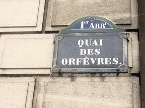 FILE - This Friday, Feb. 6, 2015 file picture shows a street sign at the 36 Quai des Orfevres police headquarters in Paris, France. Two anti-gang French policemen are going on trial over charges of gang-raping a Canadian tourist at Paris police headquarters.