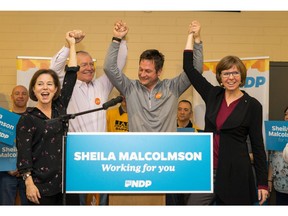 NDP MLAs Selina Robinson (left to right), Scott Fraser and Rob Fleming celebrate Sheila Malcolmson's nomination as the NDP candidate in the upcoming Nanaimo byelection.