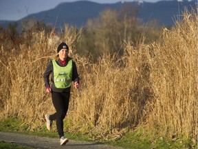 Lynn Kanuka, who holds running clinics to prep runners for SunRun, runs at Burnaby Lake, Burnaby,  January 11 2019.