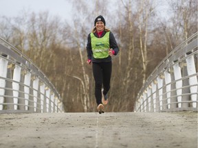 Lynn Kanuka, who holds running clinics to prep runners for SunRun, runs at Burnaby Lake, Burnaby, Jan. 11 2019.