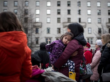 Michiko Lee, 4, is held by her mother Andrea Lee while attending the third annual Women's March in Vancouver, on Saturday January 19, 2019.