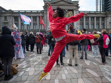 Julian Grandberry leaps through the air while dancing during the third annual Women's March in Vancouver, on Saturday January 19, 2019.