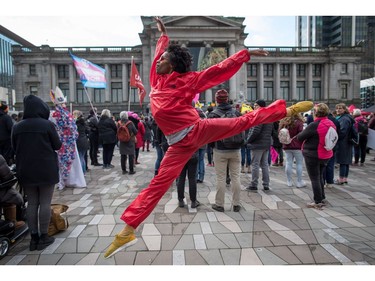 Julian Grandberry leaps through the air while dancing during the third annual Women's March in Vancouver, on Saturday January 19, 2019.