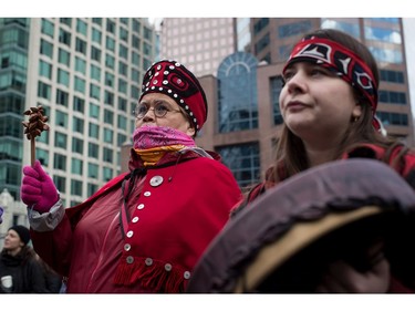 Indigenous women Verna Benson, left, and Veronica Rose, both of the Gitxsan First Nation, listen during the third annual Women's March in Vancouver, on Saturday January 19, 2019.