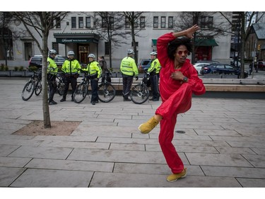 Julian Grandberry dances in front of police officers waiting to help control traffic during the third annual Women's March in Vancouver, on Saturday January 19, 2019.