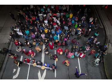 Drummers lead hundreds of people through downtown during the third annual Women's March in Vancouver, on Saturday January 19, 2019.