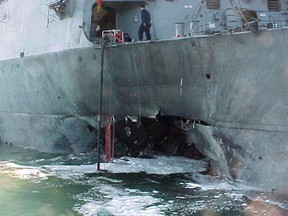 This Handout file photo taken October 12, 2000 shows the port side of the guided missile destroyer USS Cole damaged after a suspected terrorist bomb exploded during a refuelling operation in the port of Aden in Yemen.