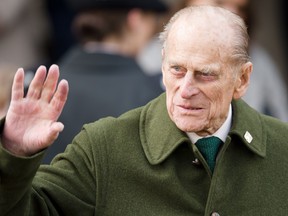 In this file photo taken on Dec. 25, 2012, Prince Philip, Duke of Edinburgh waves to well-wishers as he leaves following the Royal family Christmas Day church service at St. Mary Magdalene Church in Sandringham, Norfolk, in the east of England (LEON NEAL/AFP/Getty Images)