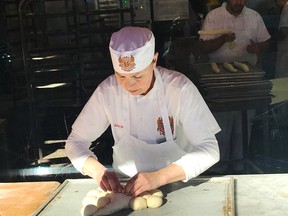 Watching the bakers through the window at Boudin Bakery’s flagship location at Fisherman’s Wharf.