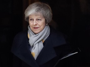 Britain's Prime Minister Theresa May leaves a cabinet meeting at Downing Street in London, Tuesday, Jan. 15, 2019.