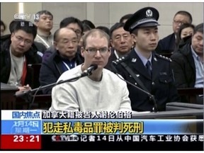 In this image taken from a video footage run by China's CCTV, Canadian Robert Lloyd Schellenberg attends his retrial at the Dalian Intermediate People's Court in Dalian, northeastern China's Liaoning province on Monday, Jan. 14, 2019. A Chinese court sentenced the Canadian man to death Monday in a sudden retrial in a drug smuggling case.