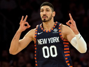 Enes Kanter #00 of the New York Knicks celebrates after hitting a three-point basket against the Milwaukee Bucks on December 25, 2018.